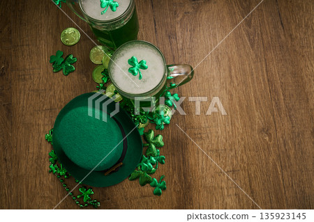 St. Patrick's day celebration with green beer and leprechaun hat St. Patrick's day celebration with green beer and leprechaun hat 135923145