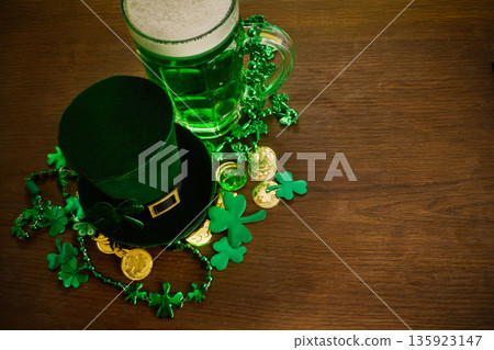 St. Patrick's day celebration with green beer, leprechaun hat St. Patrick's day celebration with green beer, leprechaun hat 135923147