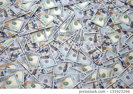 Very big amount of US hundred dollar bills close up. Huge quantity of united states currency notes on flat table Very big amount of US hundred dollar bills close up. Huge quantity of united states currency notes on flat table 135923266