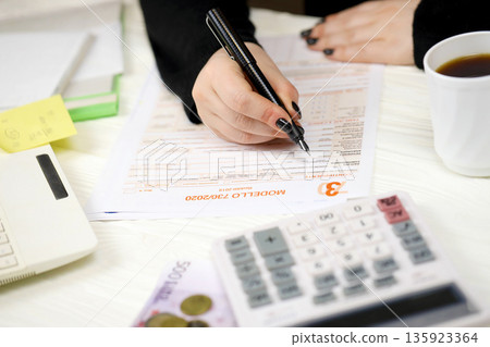 Accountant fill italian tax form Modello 730 individual income tax return in end of tax period. Taxation and paperwork routine in Italy 135923364
