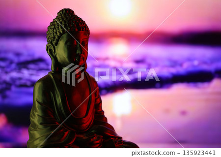 Buddha Purnima and Vesak day concept, Buddha statue with low key light against beautiful and colorful background close up. Meditation 135923441