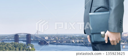 Businessman and skyline view. Businessman and skyline view. 135923625