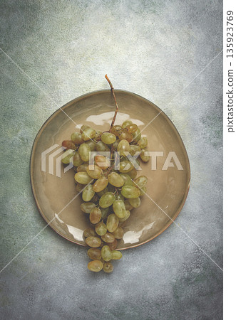 a branch of white grapes, wine grapes, Georgian grape variety Rkatsiteli, top view, a branch of white grapes, wine grapes, Georgian grape variety Rkatsiteli, top view, 135923769