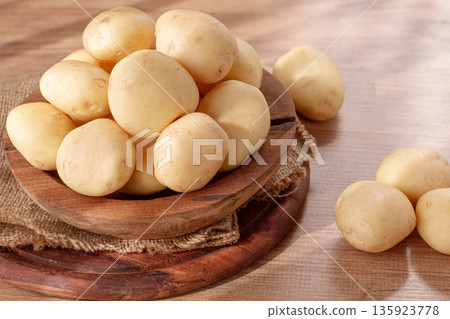 boiled new potatoes, in a wooden bowl, on a rustic table, natural light, no people, boiled new potatoes, in a wooden bowl, on a rustic table, natural light, no people, 135923778
