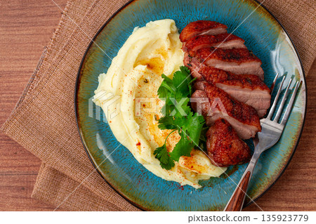 roast duck breast, sliced with mashed potatoes, on a plate,close-up, no people, roast duck breast, sliced with mashed potatoes, on a plate,close-up, no people, 135923779