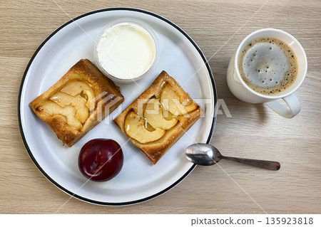 Delicious Apple Tarts with Coffee and Yogurt for Breakfast Delicious Apple Tarts with Coffee and Yogurt for Breakfast 135923818