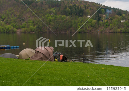 Fishing tents and rods on riverbank at Nova Zivohost, Czech Republic 135923945