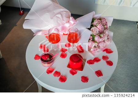 Top View of Table with Glasses Heart Desserts and Roses Top View of Table with Glasses Heart Desserts and Roses 135924214