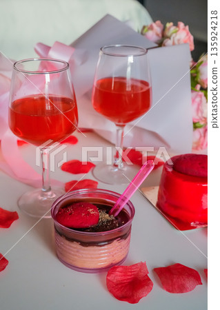 Glasses with Red Drink and Heart Desserts on Table Glasses with Red Drink and Heart Desserts on Table 135924218