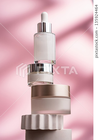 Anti-aging skincare set with serum and creams on pink background Anti-aging skincare set with serum and creams on pink background 135924464