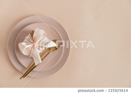 Gift Box on Elegant Table Setting. Romantic Valentines Day Flatlay in Soft Pink Tones 135925614