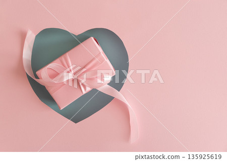 Blue Heart Cutout. Romantic Valentines Day Flatlay with Gift Box on Pink Background Blue Heart Cutout. Romantic Valentines Day Flatlay with Gift Box on Pink Background 135925619