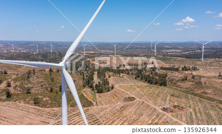 Wind green energy. Wind turbines stand tall in a vast landscape, showcasing renewable energy generation and ecological sustainability for a greener future 135926344
