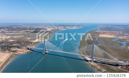 Aerial view shows Guadiana International Bridge spanning the river Guadiana, linking Vila Real Santo Antonio in Portugal with Ayamonte in Spain Aerial view shows Guadiana International Bridge spanning the river Guadiana, linking Vila Real Santo Antonio in Portugal with Ayamonte in Spain 135926376