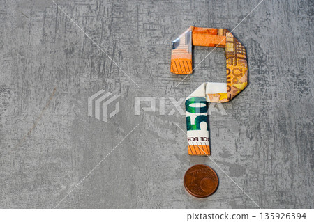 Question mark made from euro banknotes on gray background, symbol of money uncertainty Question mark made from euro banknotes on gray background, symbol of money uncertainty 135926394