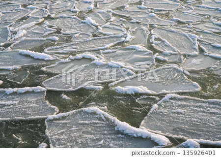Frozen Baltic Sea ice pattern with textured floes and crystalline edges near Liepaja coastline Frozen Baltic Sea ice pattern with textured floes and crystalline edges near Liepaja coastline 135926401