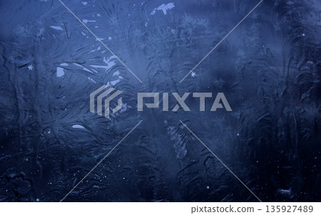 Dark pattern of absolutely frozen surface with very small snowflakes. Close up of Frost Patterns on Blue Surface Dark pattern of absolutely frozen surface with very small snowflakes. Close up of Frost Patterns on Blue Surface 135927489