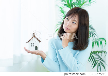 A woman worried about real estate A woman worried about real estate 135927593