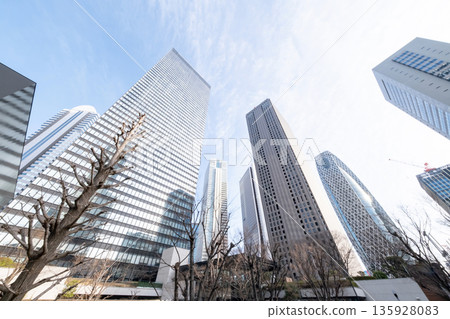 Landscape of the office town looking up at a skyscraper Landscape of the office town looking up at a skyscraper 135928083