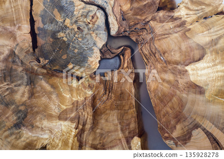 Tree cut slice section, uneven shape, natural texture, soft colored brown and yellow stump natural vintage cracked old colorful background. Do It Yourself art concept. Tree cut slice section, uneven shape, natural texture, soft colored brown and yellow stump natural vintage cracked old colorful background. Do It Yourself art concept. 135928278