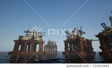 Massive industrial drilling platforms extracting petroleum from deep sea reserves using cranes. Maritime energy production facility ships operating in international waters 135928482