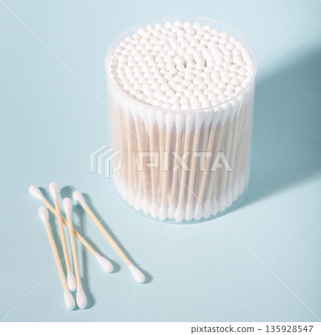 Cotton swabs in container for personal hygiene Cotton swabs in container for personal hygiene 135928547