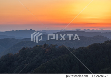 Bitchu Matsuyama Castle and the sunset sky as seen from the Unkai Observatory in Takahashi City, Okayama Prefecture, Japan 135928676