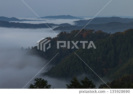 Bitchu Matsuyama Castle and the sea of clouds seen early in the morning from the Unkai Observatory in Takahashi City, Okayama Prefecture, Japan 135928690
