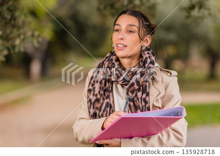 Volunteer collecting signatures for a social cause 135928718