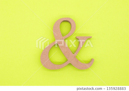 Ampersand on a yellow-green background Ampersand on a yellow-green background 135928883