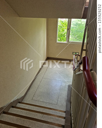 Downhill emergency stairs in the apartment interior. Downhill emergency stairs in the apartment interior. 135929252