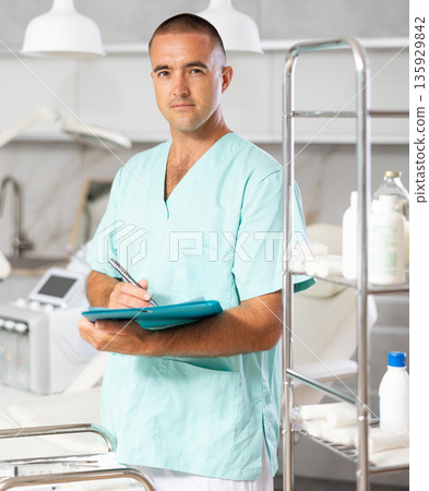 Doctor meticulously documents Doctor meticulously documents 135929842