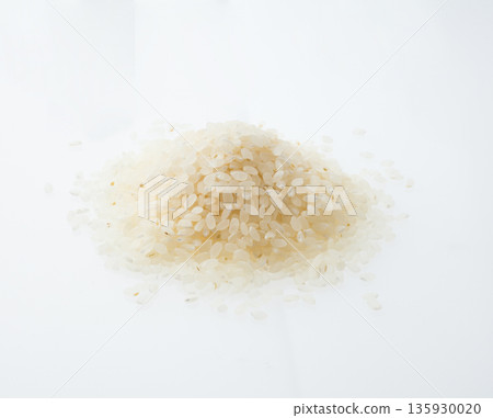 Rice grains on a white background Rice grains on a white background 135930020