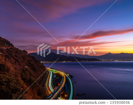 The morning sky from Satta Pass, Mount Fuji and car light trails on Suruga Bay The morning sky from Satta Pass, Mount Fuji and car light trails on Suruga Bay 135930036