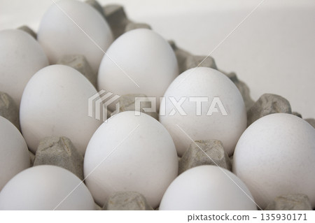 These are white eggs in an egg carton. These are white eggs in an egg carton. 135930171