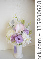 Pink Buddhist flower arrangement 135930628