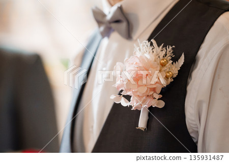 Elegant Groom Wearing Black Vest and White Shirt with Pink Hydrangea Boutonniere at Wedding Ceremony 135931487