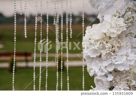 Elegant White Floral Arch with Crystal Bead Drapes for Wedding Ceremony Outdoor Backdrop Decor Elegant White Floral Arch with Crystal Bead Drapes for Wedding Ceremony Outdoor Backdrop Decor 135931609