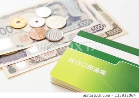 Bankbook and cash on white background Bankbook and cash on white background 135932064