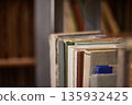 Many book shelves in a library 135932425