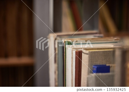 Many book shelves in a library Many book shelves in a library 135932425