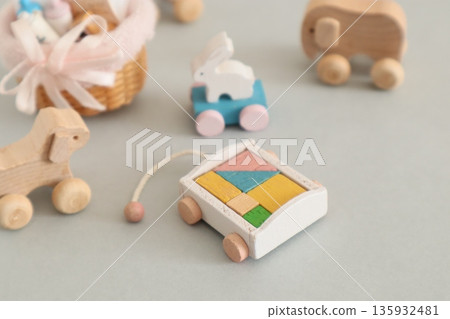 A small baby bottle, a rolling rabbit, and building blocks 135932481