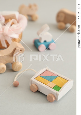 A small baby bottle, a rolling rabbit, and building blocks 135932483