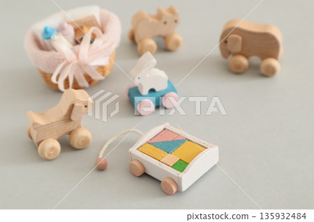 A small baby bottle, a rolling rabbit, and building blocks 135932484