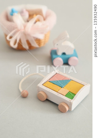 A small baby bottle, a rolling rabbit, and building blocks 135932490