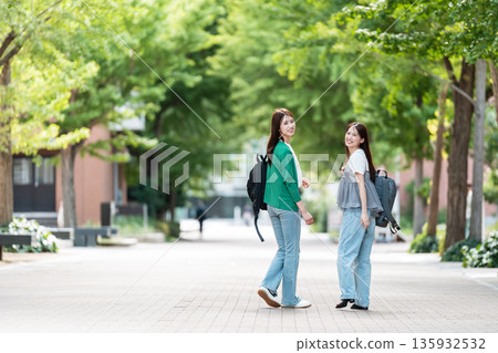 Female college student walking on university campus Female college student walking on university campus 135932532