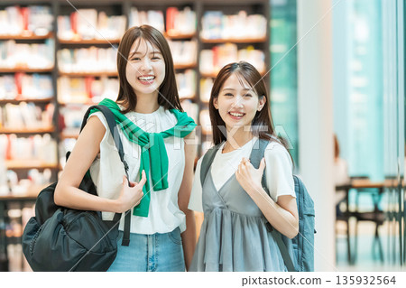 Young female college student shopping Young female college student shopping 135932564