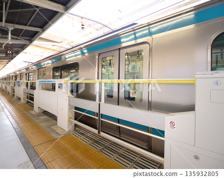A train stopping at a station platform in Kanagawa Prefecture A train stopping at a station platform in Kanagawa Prefecture 135932805