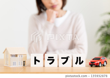 A middle-aged woman worried about a block of trouble A middle-aged woman worried about a block of trouble 135932878