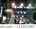 Audience filming the concert hall 135932967